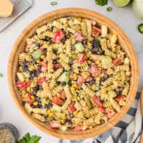 A wooden bowl filled with jalapeno ranch pasta salad.