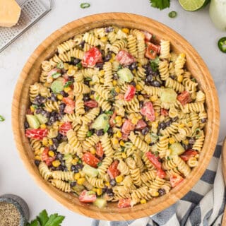 A wooden bowl filled with jalapeno ranch pasta salad.