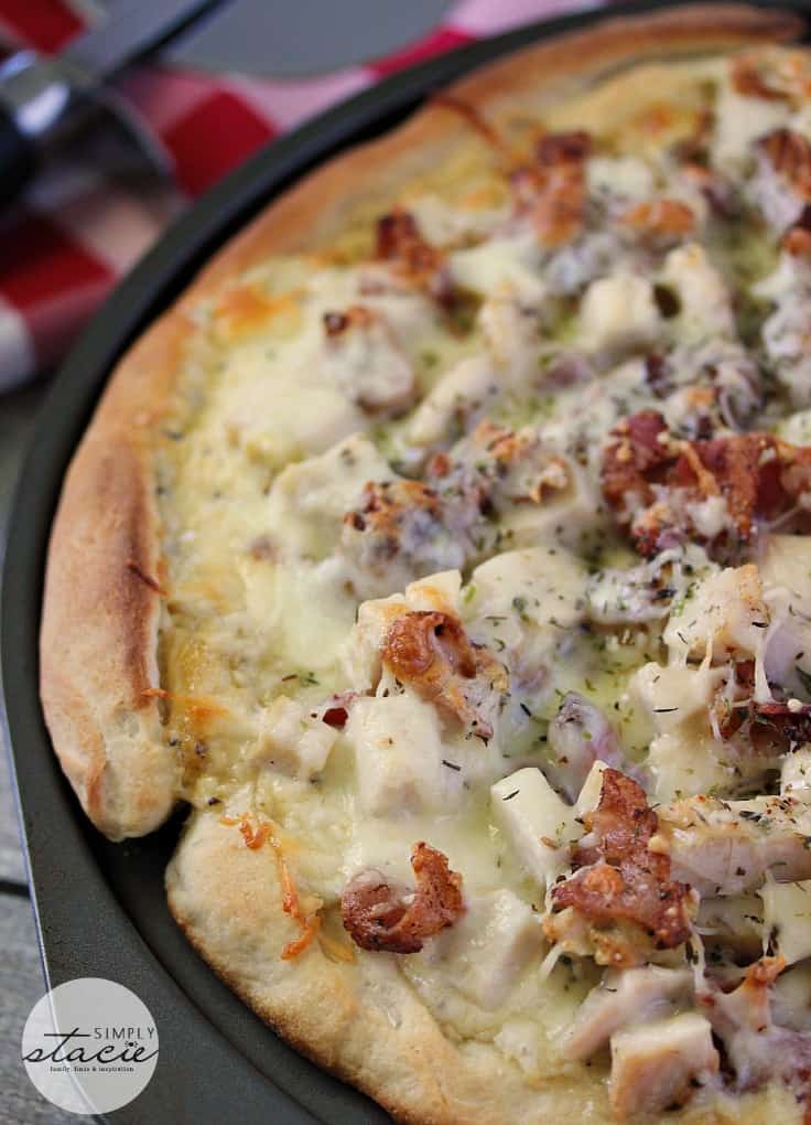 Chicken Caesar Pizza - Your favorite salad can also be your favorite homemade pizza recipe! Ditch the lettuce and make this simple crowdpleaser. Imagine pizza crust smothered in creamy Caesar dressing, topped with bacon, chicken and cheese!