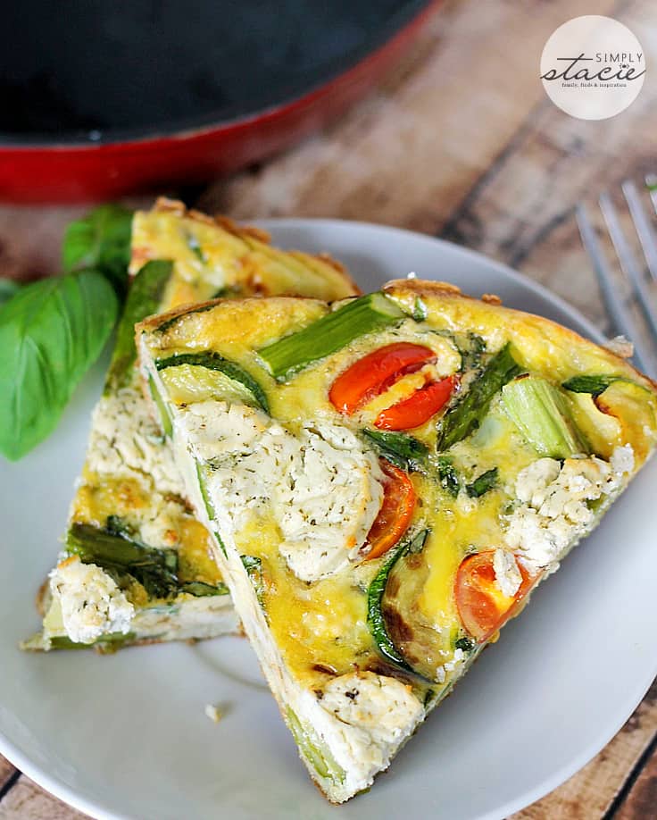 Spring Vegetable & Goat Cheese Frittata - Loaded with the fresh flavours of spring, featuring asparagus, zucchini, tomatoes and the creamy tang of goat cheese, this frittata is very versatile. It can be served warm or at room temperature and is a great breakfast, lunch, or paired with salad, and quick, light dinner option.