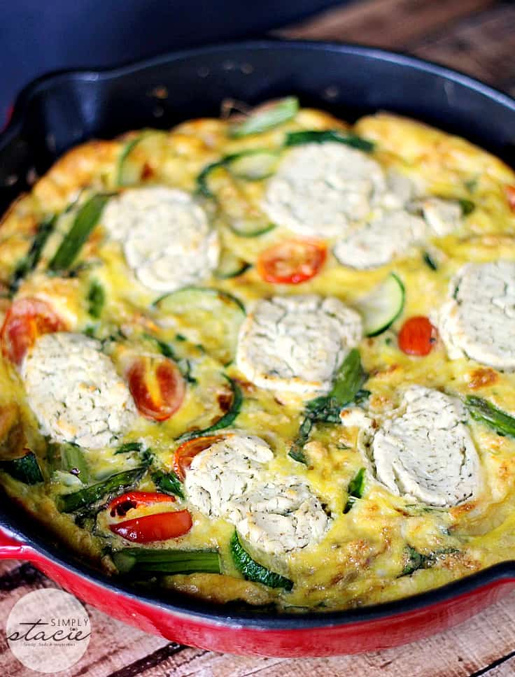 Spring Vegetable & Goat Cheese Frittata - Loaded with the fresh flavours of spring, featuring asparagus, zucchini, tomatoes and the creamy tang of goat cheese, this frittata is very versatile. It can be served warm or at room temperature and is a great breakfast, lunch, or paired with salad, and quick, light dinner option.