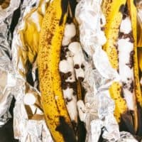 The recipe in aluminum foil on a baking pan.