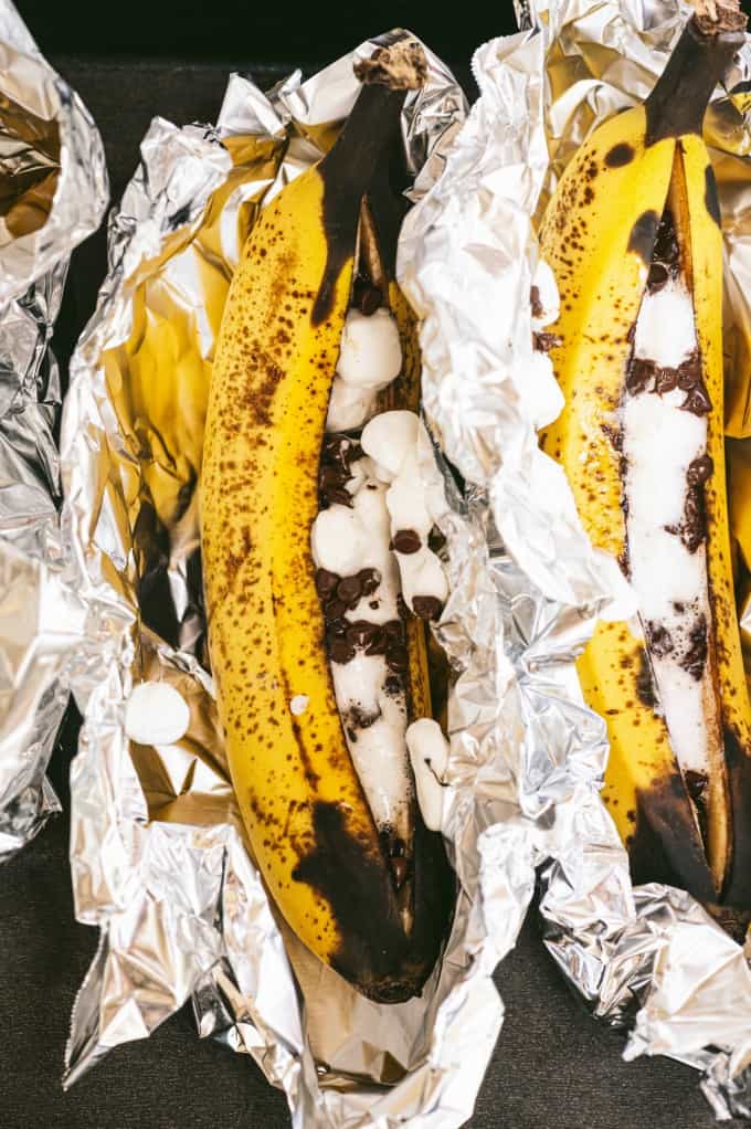 Banana Boats - The perfect camping dessert! Ripe bananas stuffed with gooey marshmallows and melty chocolate are always in season.