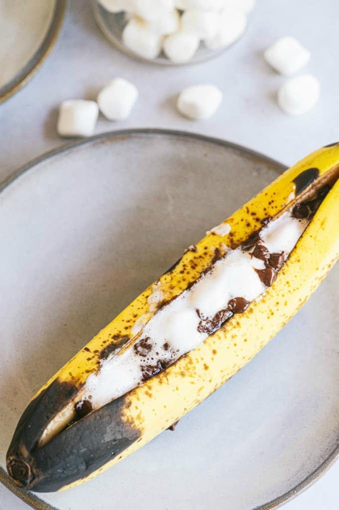 Banana Boats - The perfect camping dessert! Ripe bananas stuffed with gooey marshmallows and melty chocolate are always in season.