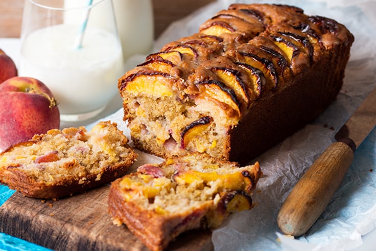 Peach Bread - Great bread for all hours! This easy, fruity loaf is the best peach baked treat out there glazed with brown sugar goodness.