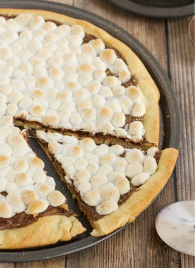 S'mores Pizza - S'mores indoors! Bring the camping to the oven with this graham cracker, chocolate, and marshmallow pizza for a great family night treat.