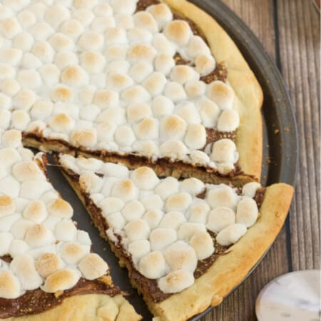 S'mores Pizza - S'mores indoors! Bring the camping to the oven with this graham cracker, chocolate, and marshmallow pizza for a great family night treat.