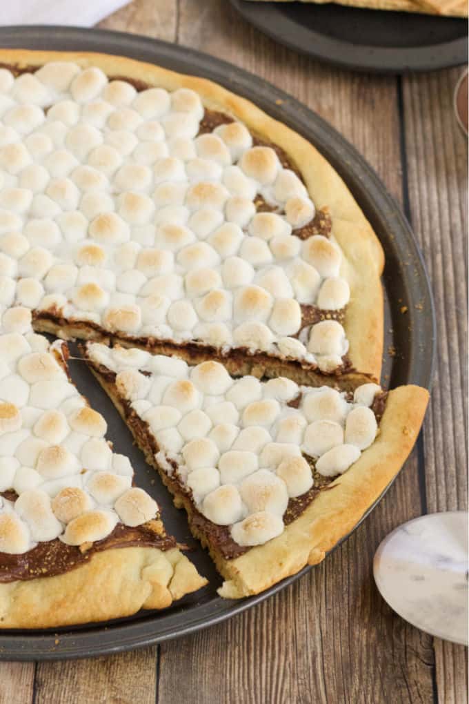 S'mores Pizza - S'mores indoors! Bring the camping to the oven with this graham cracker, chocolate, and marshmallow pizza for a great family night treat.