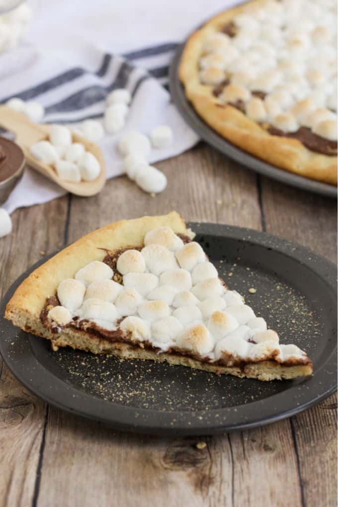 S'mores Pizza - S'mores indoors! Bring the camping to the oven with this graham cracker, chocolate, and marshmallow pizza for a great family night treat.