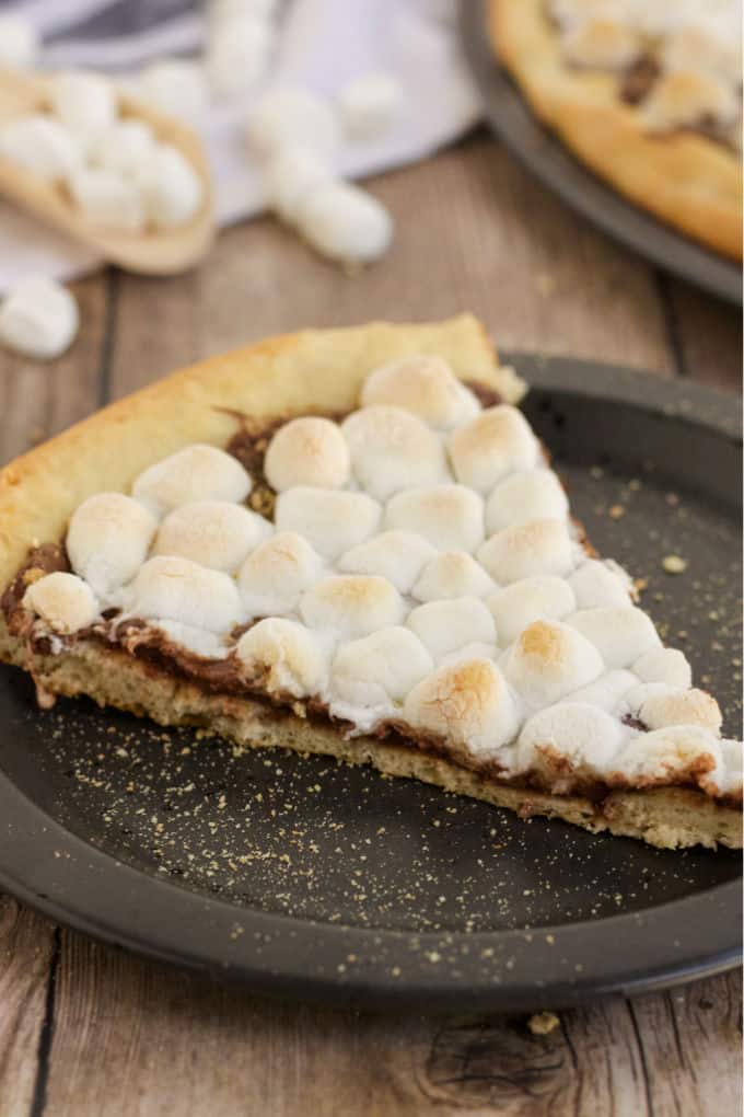 S'mores Pizza - S'mores indoors! Bring the camping to the oven with this graham cracker, chocolate, and marshmallow pizza for a great family night treat.