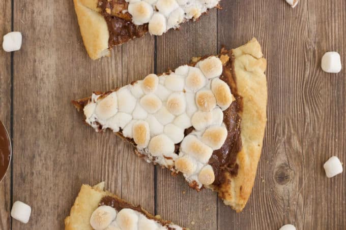 S'mores Pizza - S'mores indoors! Bring the camping to the oven with this graham cracker, chocolate, and marshmallow pizza for a great family night treat.