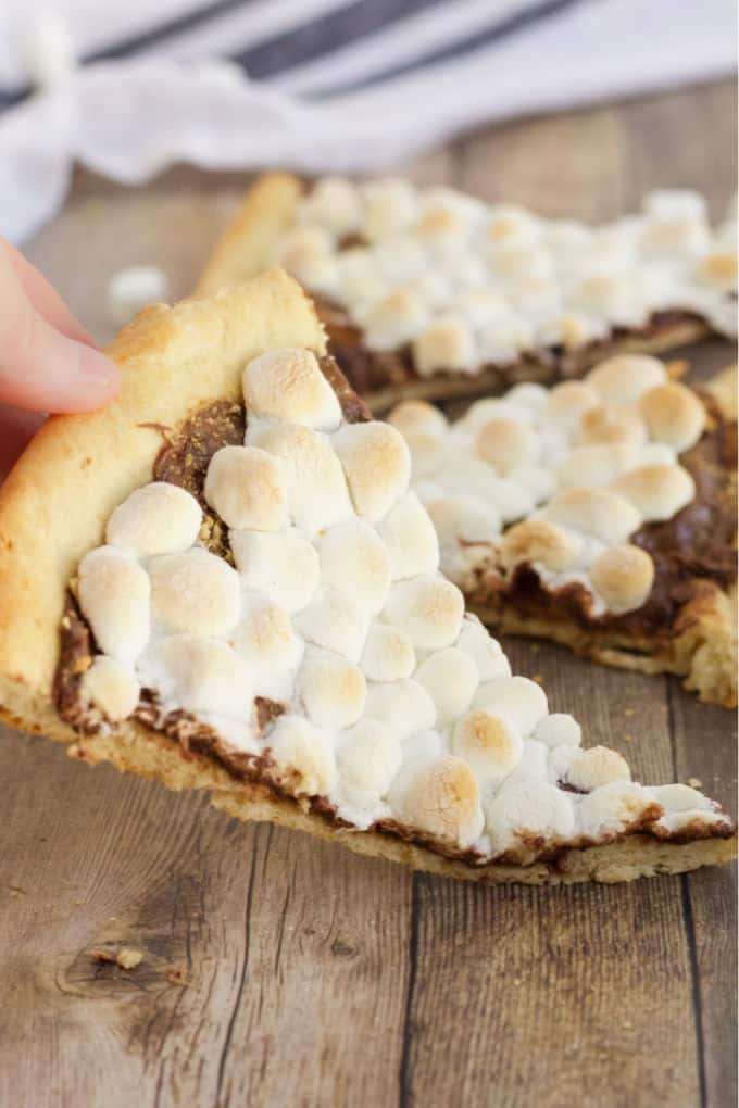 S'mores Pizza - S'mores indoors! Bring the camping to the oven with this graham cracker, chocolate, and marshmallow pizza for a great family night treat.