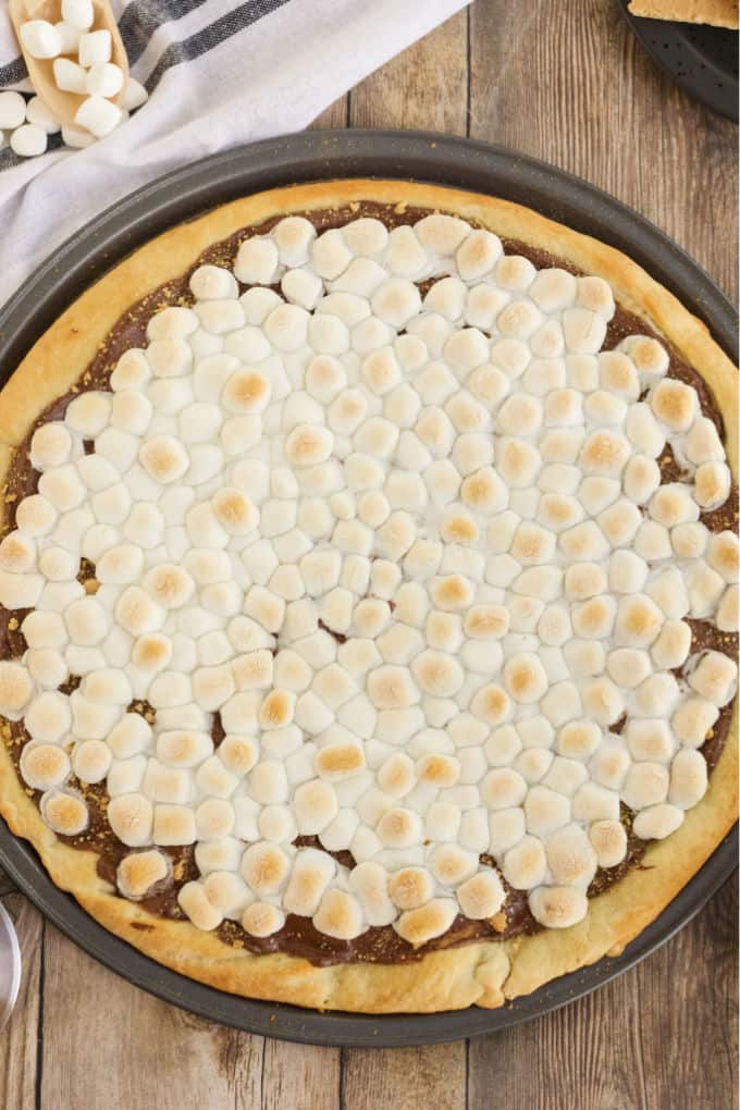 S'mores Pizza - S'mores indoors! Bring the camping to the oven with this graham cracker, chocolate, and marshmallow pizza for a great family night treat.