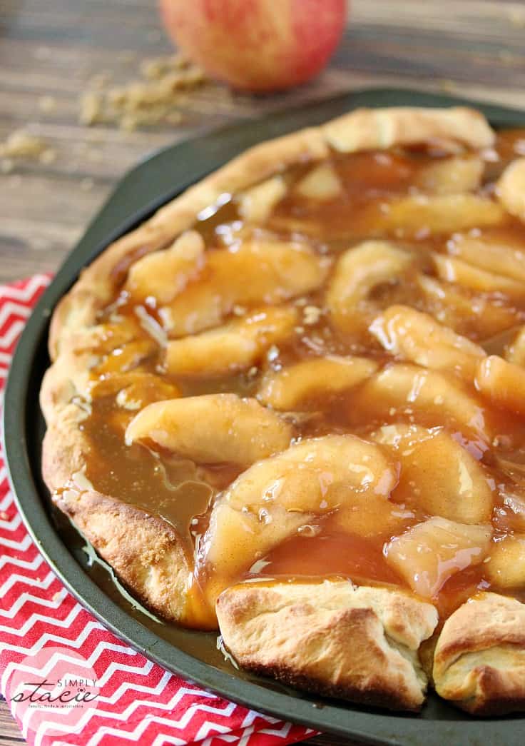 Caramel Apple Pizza - The PERFECT fall dessert pizza! Sweet cinnamon apple pie filling with rich caramel covering a basic pizza crust for the taste of pie without the mess and wait.