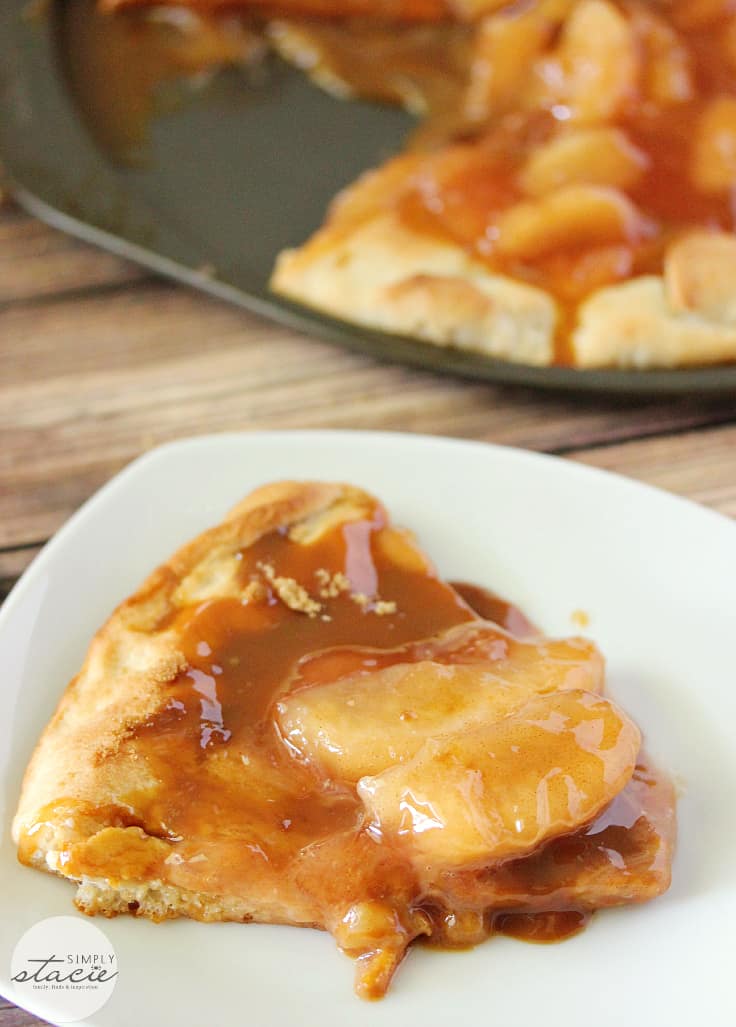 Caramel Apple Pizza - The PERFECT fall dessert pizza! Sweet cinnamon apple pie filling with rich caramel covering a basic pizza crust for the taste of pie without the mess and wait.