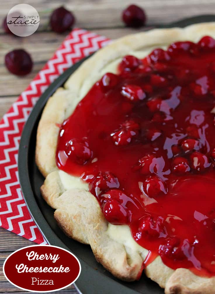 Cherry Cheesecake Pizza - NYC's favorites combined for the best dessert pizza! Smooth cheesecake filling covered with cherries in a thick, sweet syrup is a perfect handheld dessert for your next party.