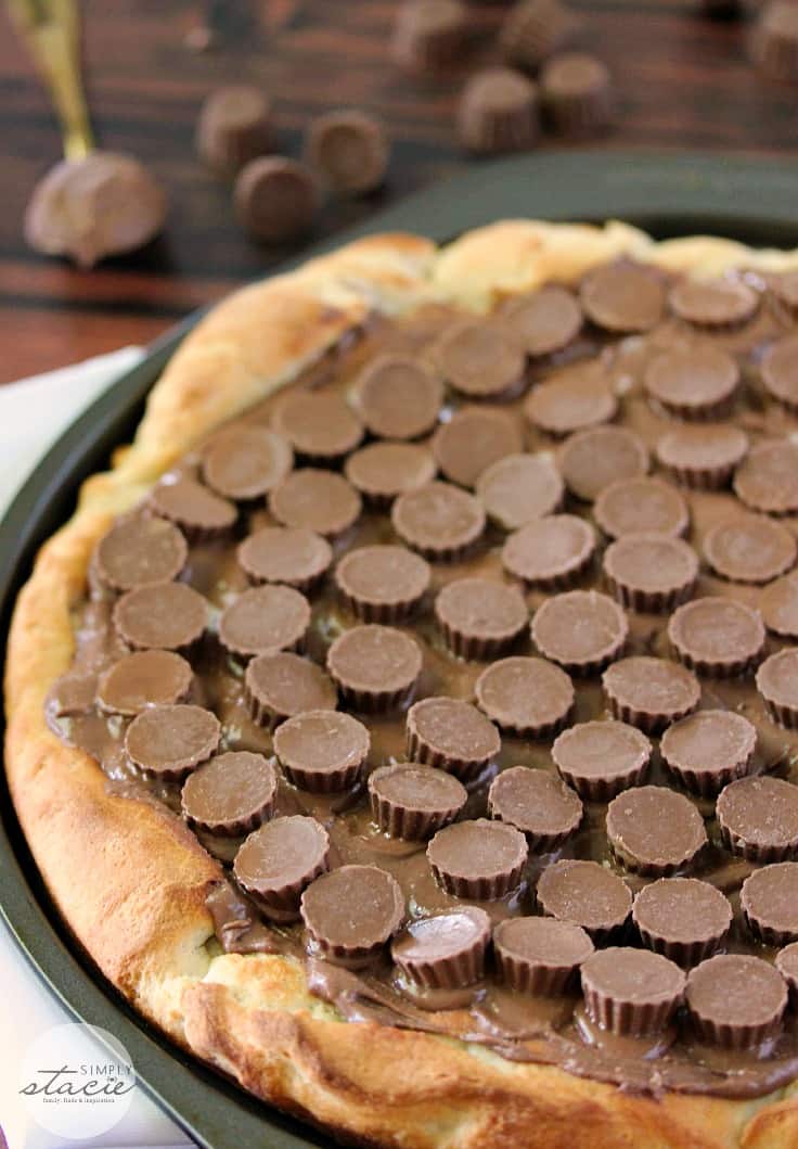 Reese Peanut Butter Pizza - Reese's lovers, rejoice! This dessert pizza is covered with a chocolatey peanut butter spread and topped with mini Reese's cups for a double dose of the sweet treat.