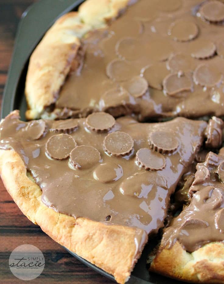 Reese Peanut Butter Pizza - Reese's lovers, rejoice! This dessert pizza is covered with a chocolatey peanut butter spread and topped with mini Reese's cups for a double dose of the sweet treat.