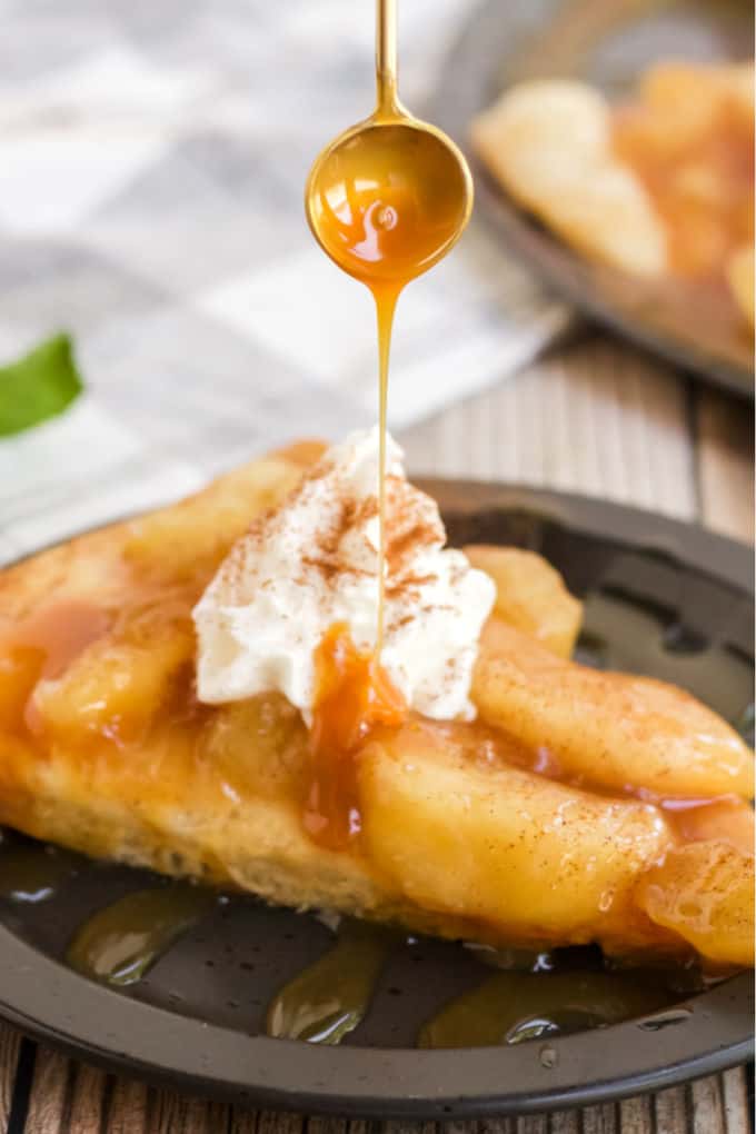 Caramel Apple Pizza - The PERFECT fall dessert pizza! Sweet cinnamon apple pie filling with rich caramel covering a basic pizza crust for the taste of pie without the mess and wait.