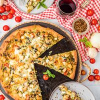 The recipe on a pizza pan with slices removed.