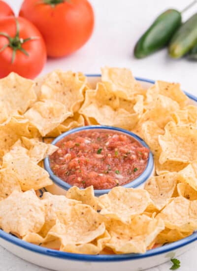 Garden salsa on a serving platter with tortilla chips.