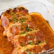 Pizza stuffed chicken in a casserole pan.