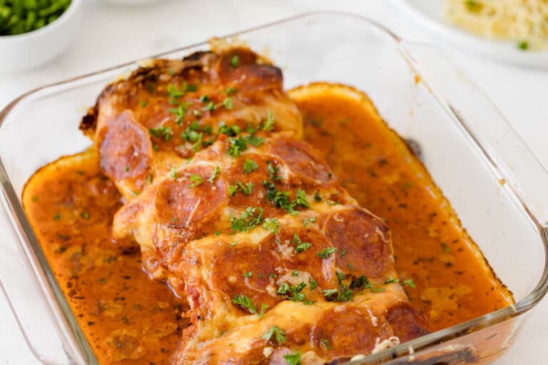 Pizza stuffed chicken in a casserole pan.