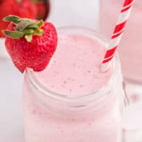 Strawberry Vanilla Smoothie - This delicious and creamy smoothie stays ice cold using convenient frozen strawberries, vanilla yogurt and milk.