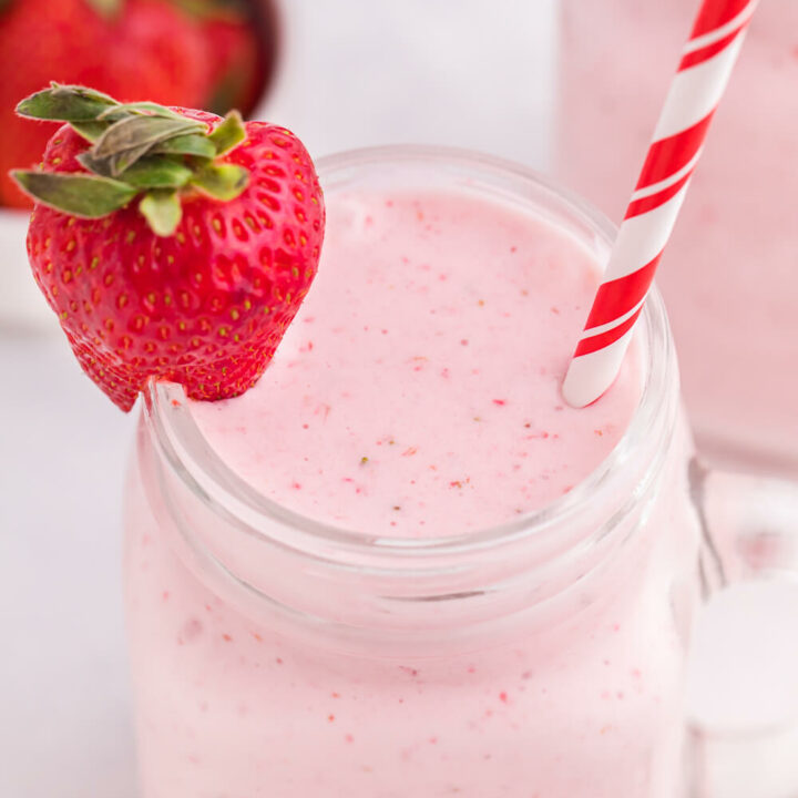 Strawberry Vanilla Smoothie - This delicious and creamy smoothie stays ice cold using convenient frozen strawberries, vanilla yogurt and milk.
