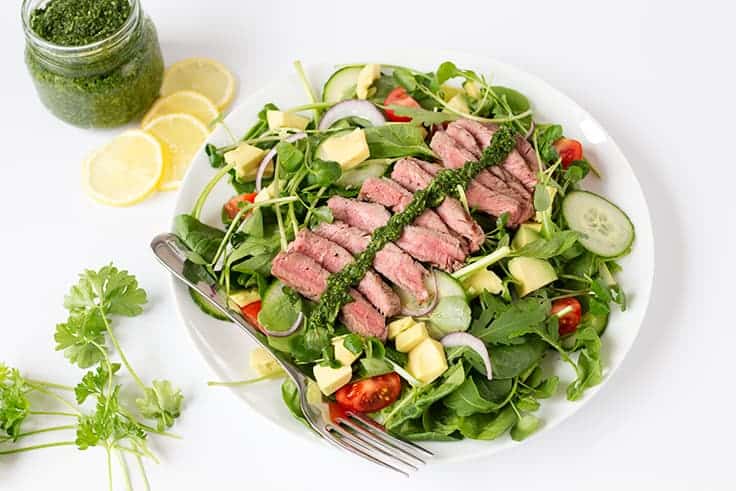 Chimichurri Steak Salad Recipe - A lighter version of your favorite steak dinner! This chumichurri recipe is so easy and goes great as a sauce or a dressing.