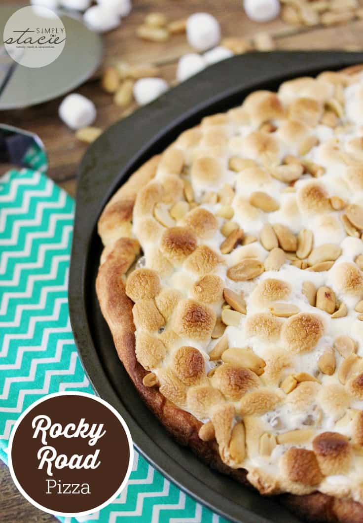 Rocky Road Pizza - Decadent dessert pizza! This pizza is loaded with creamy Nutella, toasted marshmallows, and crunchy peanuts.