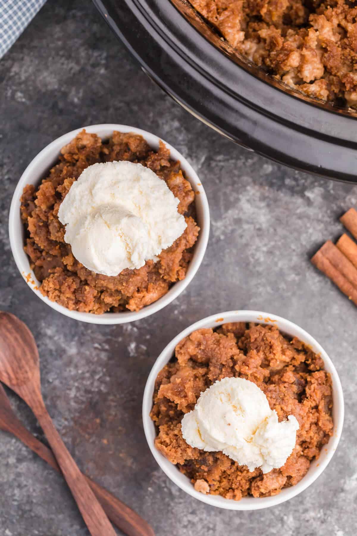 Slow Cooker Pumpkin Dump Cake - This is the easiest fall dessert! Your family will beg for this Crockpot dessert recipe made with boxed cake mix all year long.