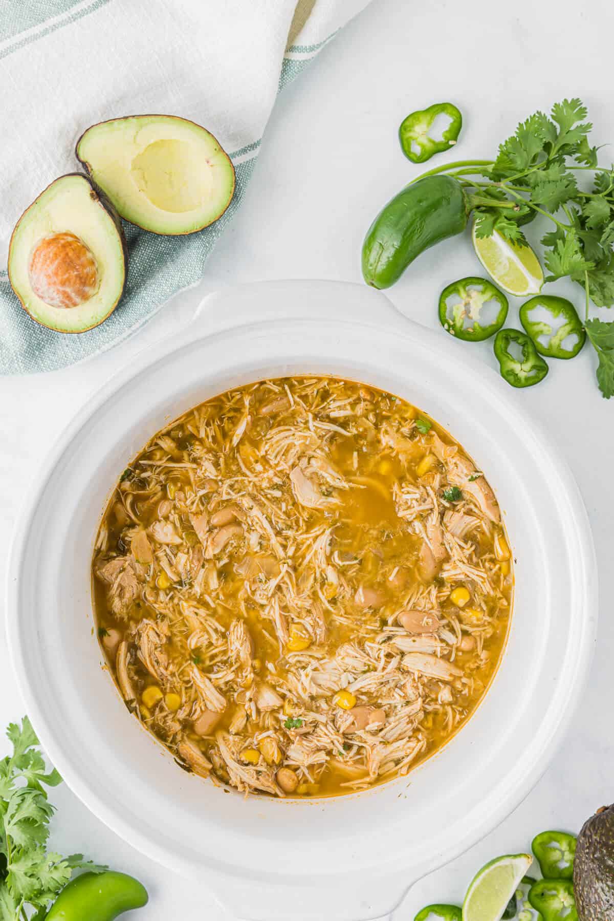 Verde Chicken Chili in a white slow cooker.