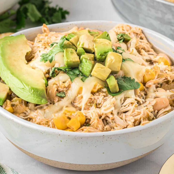 Slow cooker verde chicken chili in a white bowl.