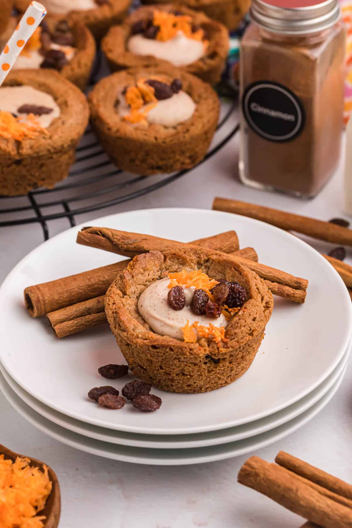 A carrot cake cup on a plate.