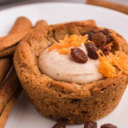 A carrot cake cup on a plate.