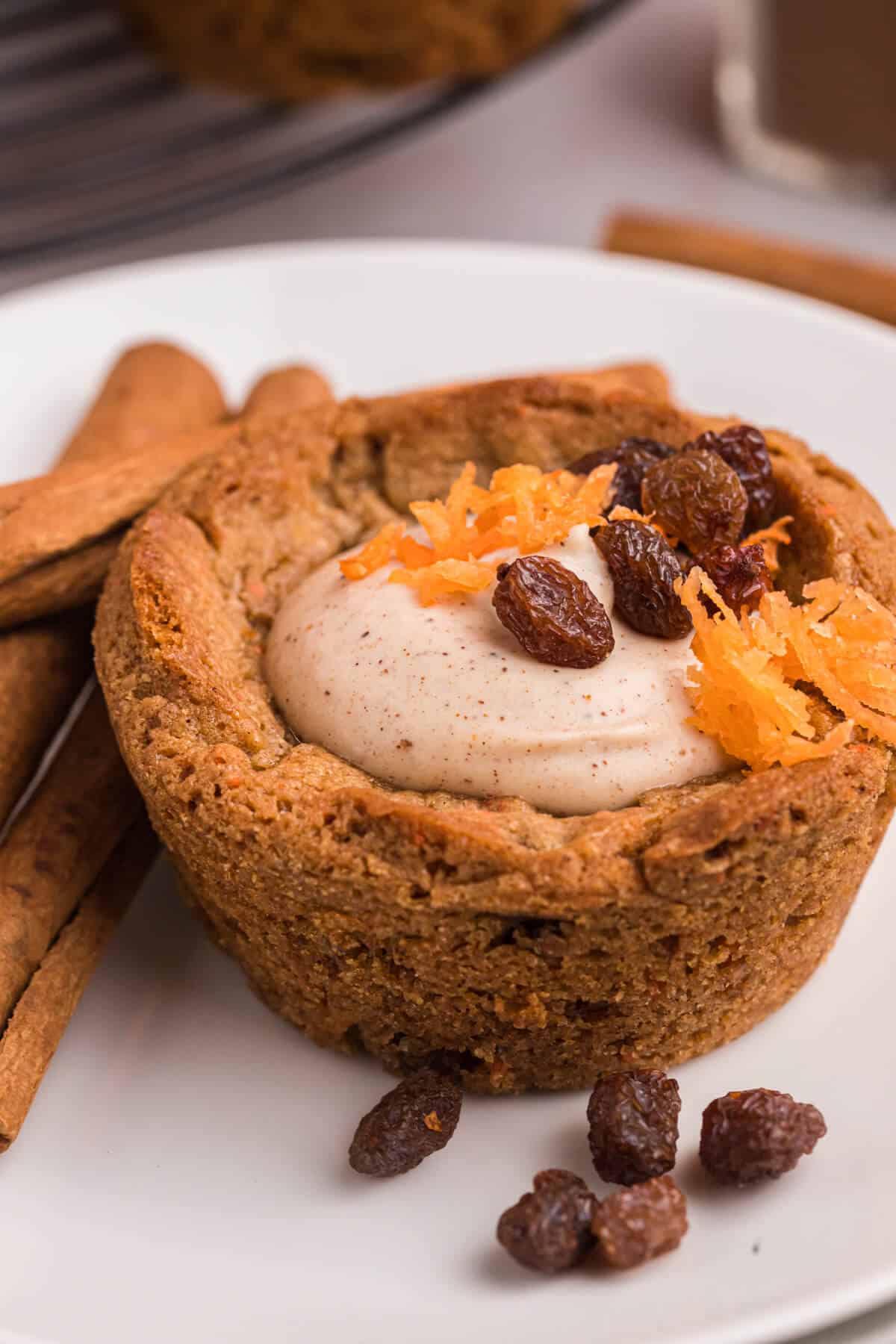 A carrot cake cup on a plate.