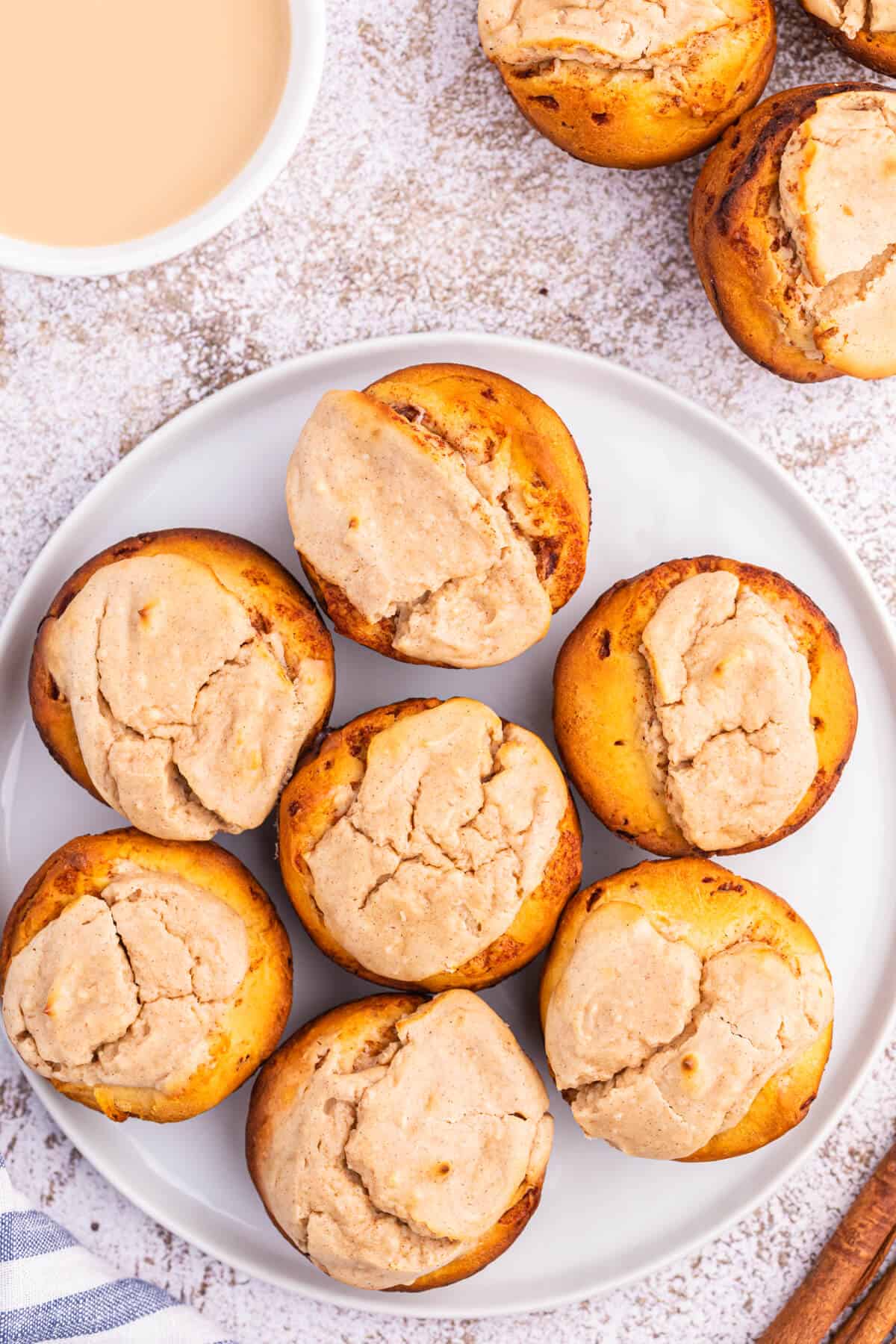 Cheesecake stuffed cinnamon rolls on a plate.