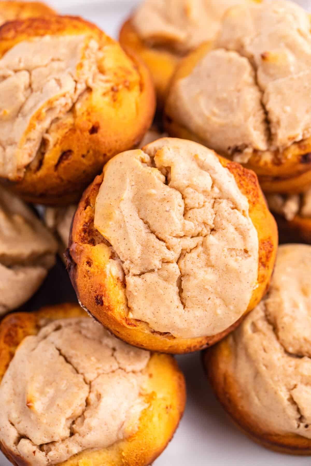 Close up of cheesecake stuffed cinnamon rolls on a plate.