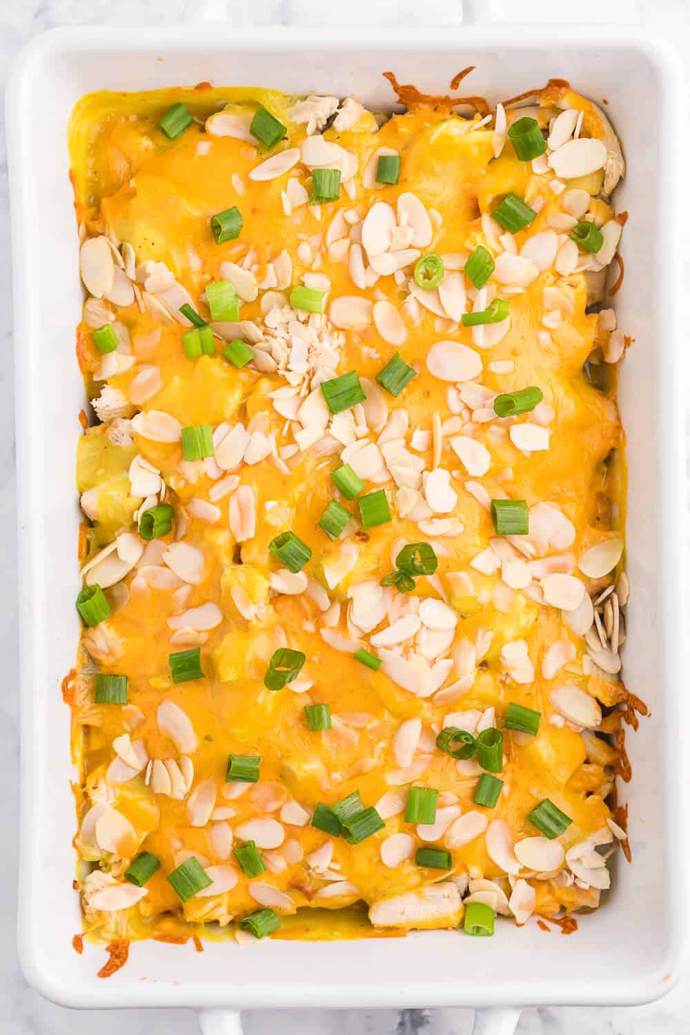 Chicken Asparagus Bake - Easily one of my favourite casserole dishes! It's loaded with asparagus, chicken, creamy curry sauce and smothered in cheese and sliced almonds.