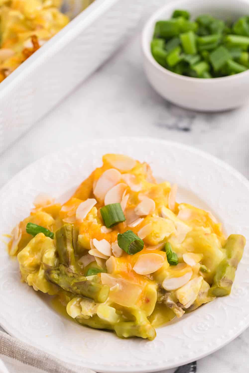 Chicken Asparagus Bake - Easily one of my favourite casserole dishes! It's loaded with asparagus, chicken, creamy curry sauce and smothered in cheese and sliced almonds.