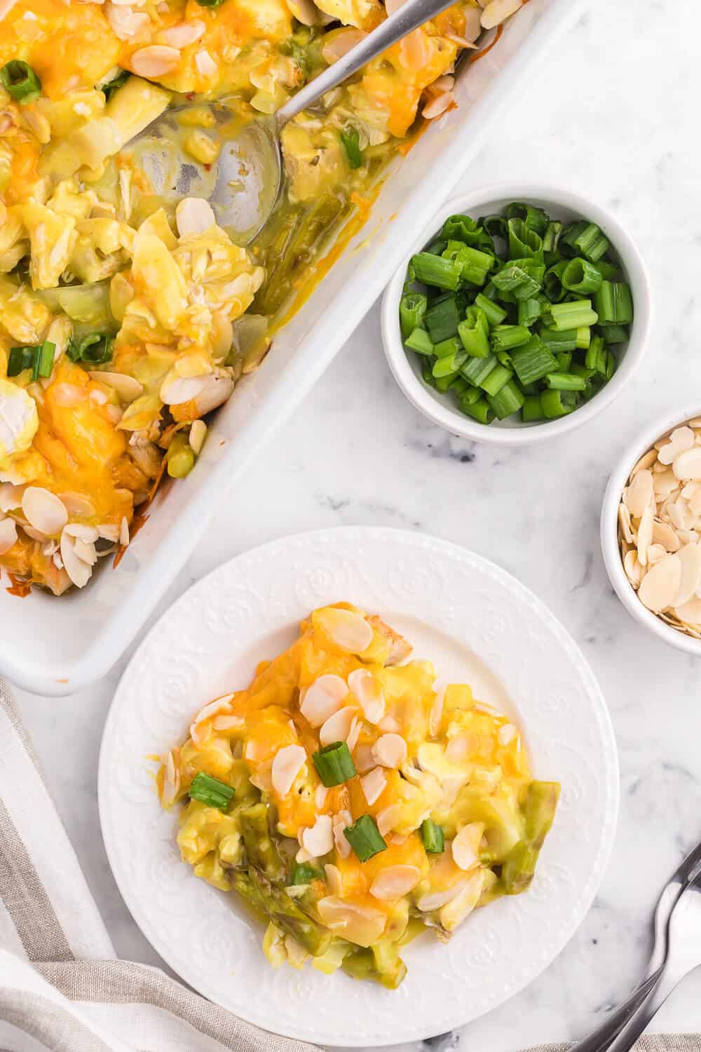 Chicken Asparagus Bake - Easily one of my favourite casserole dishes! It's loaded with asparagus, chicken, creamy curry sauce and smothered in cheese and sliced almonds.