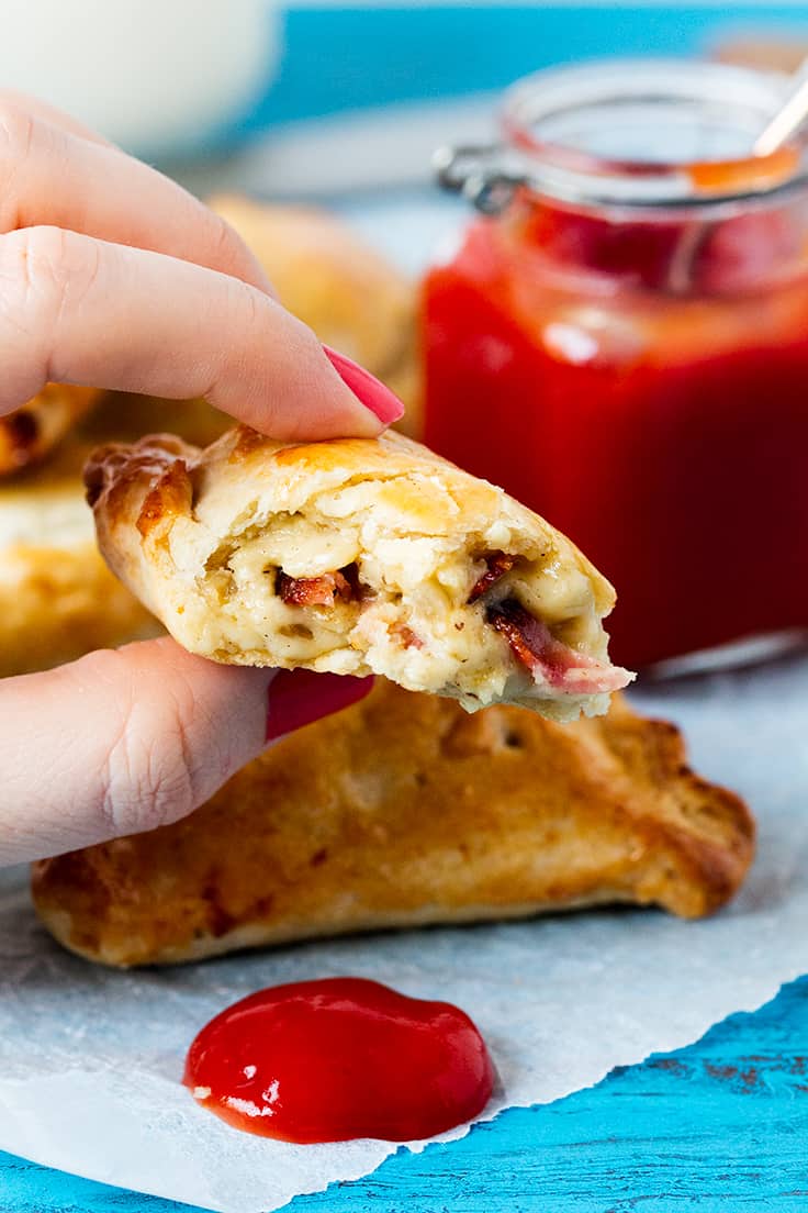 Cheese and Bacon Hand Pies - Hearty and comforting! These handheld meat pies are stuffed with bacon and cheese for a savory treat at any meal.