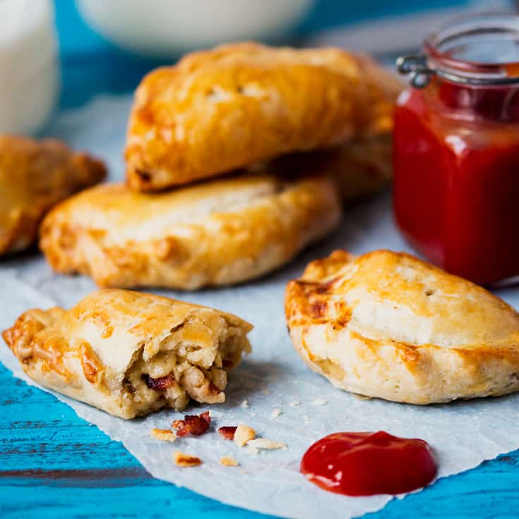 Cheese and Bacon Hand Pies - Hearty and comforting! These handheld meat pies are stuffed with bacon and cheese for a savory treat at any meal.