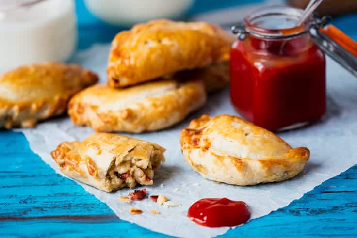 Cheese and Bacon Hand Pies - Hearty and comforting! These handheld meat pies are stuffed with bacon and cheese for a savory treat at any meal.