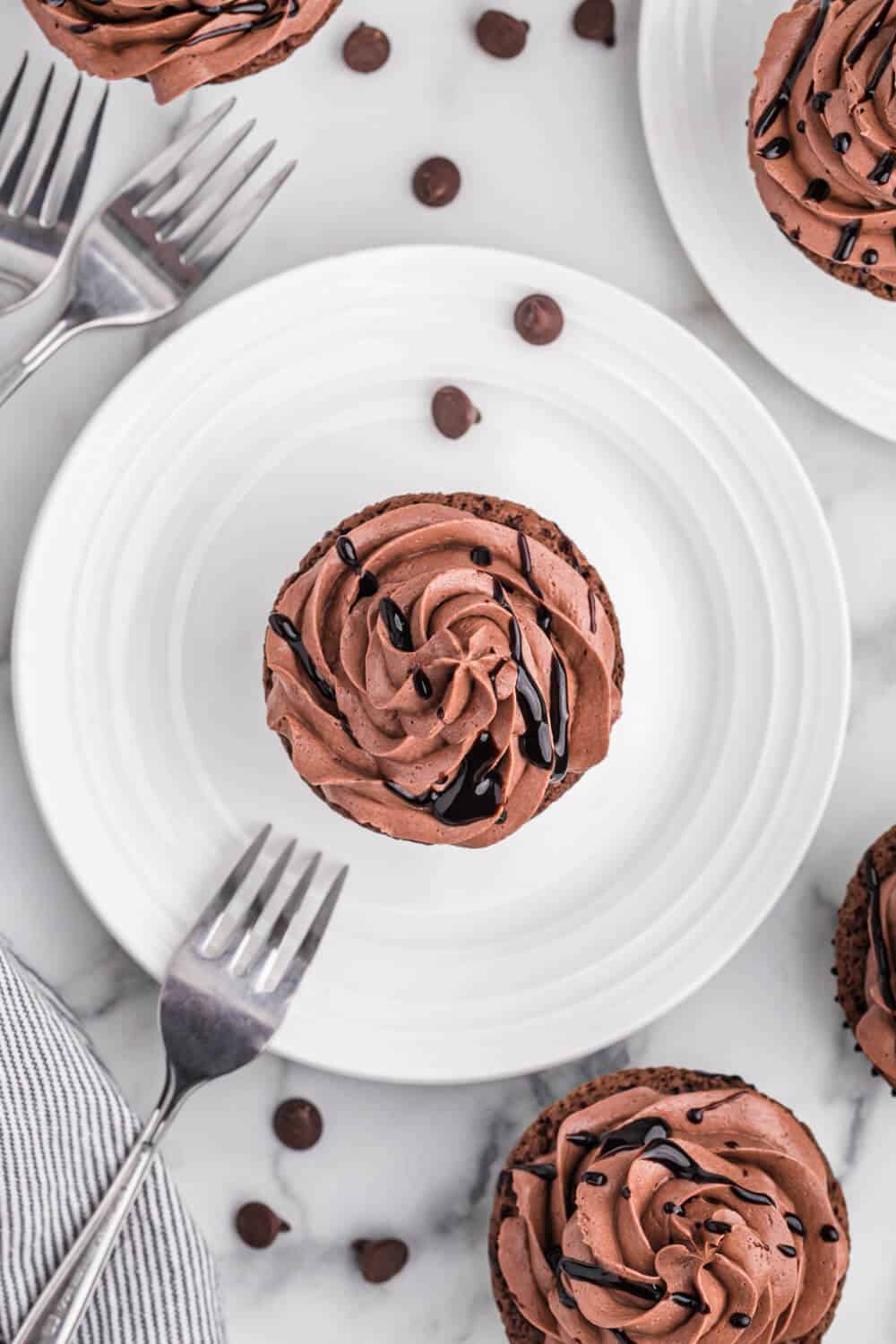 Death by Chocolate Cupcakes on a white plate with a fork