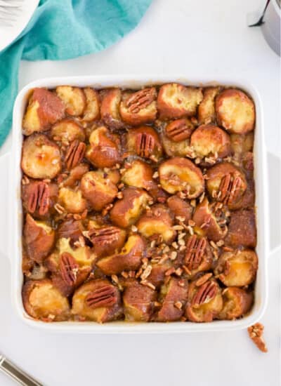 Caramel Pecan Breakfast Casserole - This is the ultimate breakfast casserole - the base is donuts! Combined with a sweet caramel and pecan topping, this easy recipe is a special occasion indulgence!