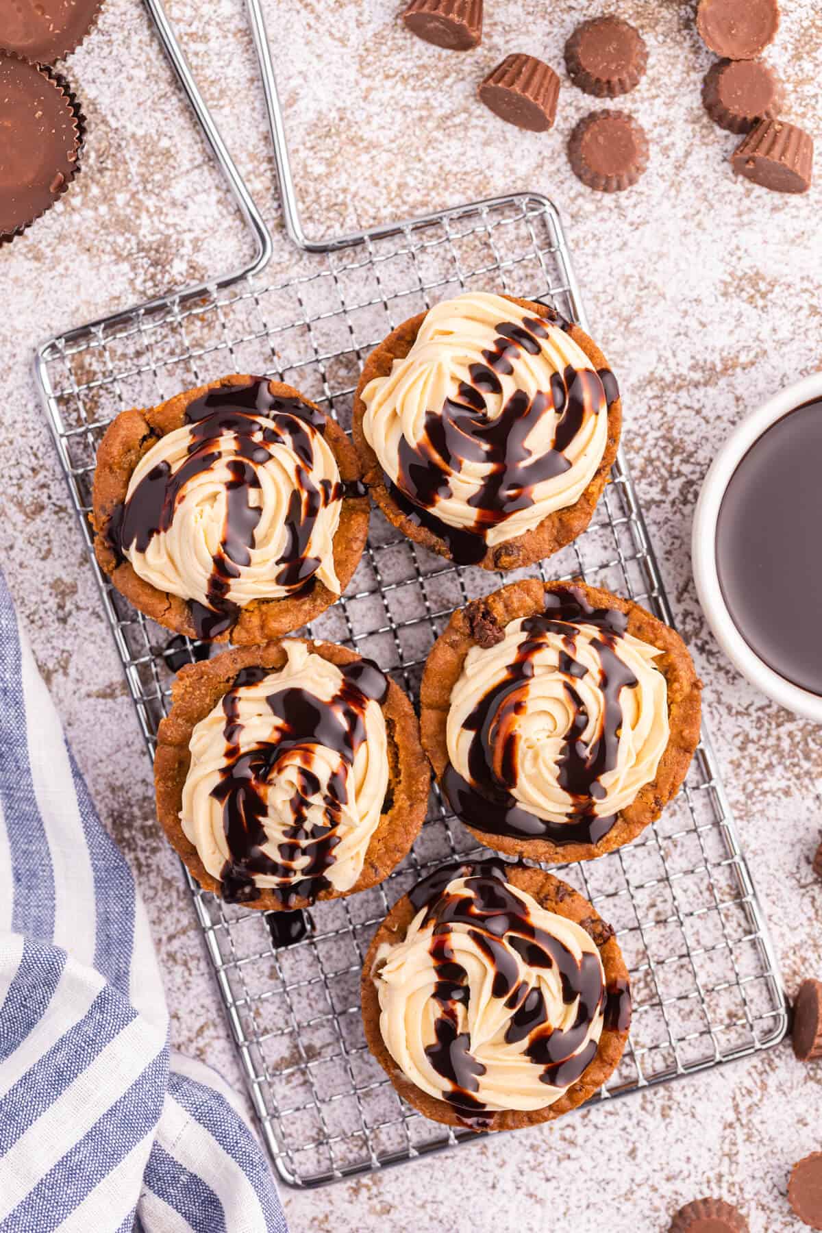 Reese's peanut butter cookie cups on wire rack.