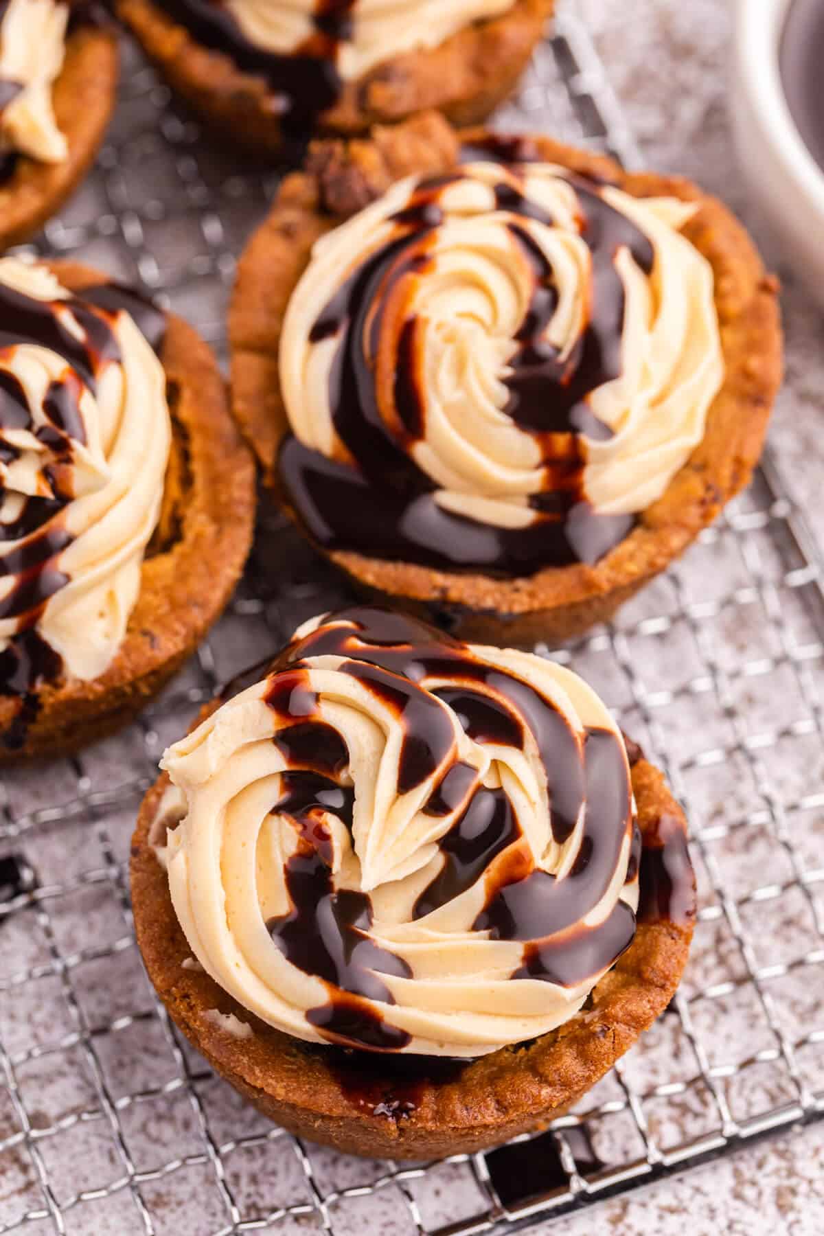 Reese's cookie cups on a wire rack.