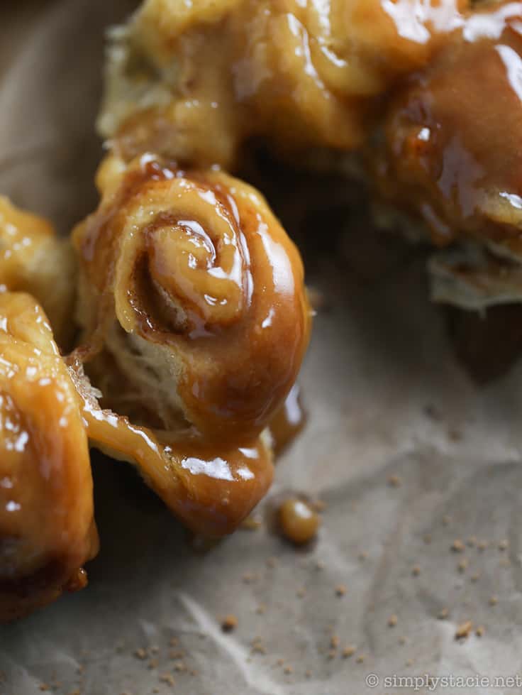 Mini Rum Butter Cinnamon Rolls - You will LOVE these "mini" bite sized treats! Picture sweet cinnamon rolls baked in a luscious rum butter sauce. Oh my.